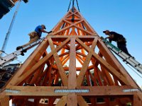 ma nb_ C9A5941  Bill Gilmore, left carpenter, Jason Hammer, owner, with Caddis Construction, triy to align the walls of the steeple they are constructing on the ground, to be hoisted to the top of the Grace Episcopal Church, in New Bedford..    PETER PEREIRA/THE STANDARD-TIMES/SCMG